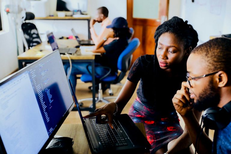 Colleagues working at their desks